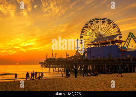 Visitors enjoy sunset above Santa Monica Pier in Los Angeles Stock Photo