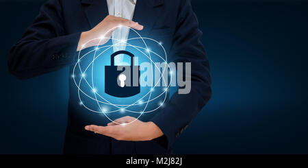 lock In the hands of a businessman Shield the shield to protect the cyberspace.Space input data Data Security Business Internet Concept. Secure inform Stock Photo