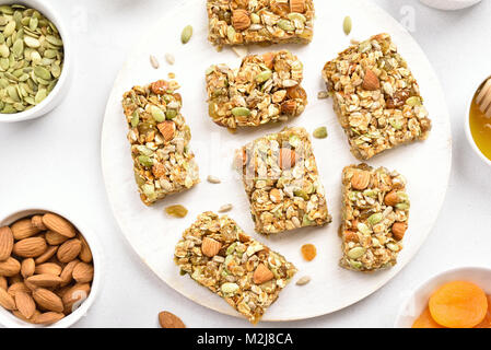 Healthy natural snack. Nutrition bar, granola on wooden board. Top view, flat lay Stock Photo