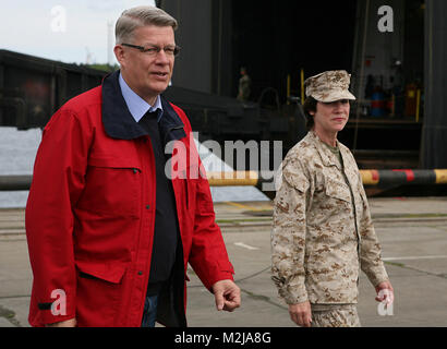 Latvian President Valdis Zatlers (left) walks with Maj. Gen. (sel.) Tracy L. Garrett, commanding general of the 4th Marine Logistics Group, prior to a distinguished visitor event at several sites around the exercise Baltic Operations 2010 training areas. Since the start the exercise on June 6th, the Marines and Sailors of 4th Landing Support Battalion and Naval Beach Group 2 have been working with members of the Armed Forces of Latvia to conduct maritime preposition force offload operations here. Latvian president walks with Marine major by EUCOM Stock Photo