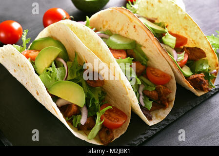 Tacos with meat and vegetables. Close up view Stock Photo