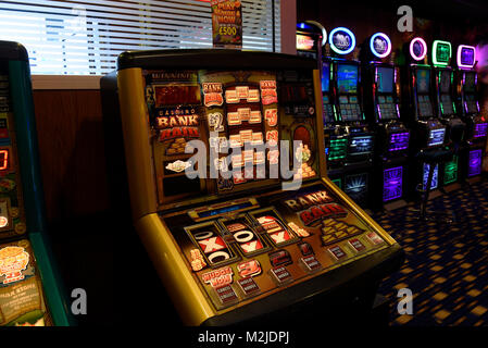 Fruit machines, gambling machines, slot machines in amusement arcade UK Stock Photo