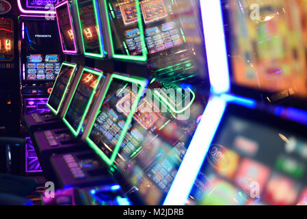 Fruit machines, gambling machines, slot machines concept, abstract in amusement arcade UK Stock Photo
