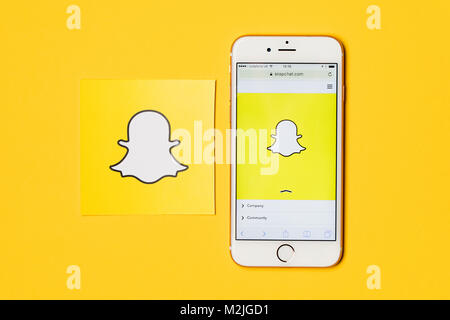 OXFORD, UK - JANUARY 9th 2017: An apple iPhone showing the Snapchat application alongside other Snapchat logos. Snapchat is a popular social media application for sharing messages, images and videos Stock Photo