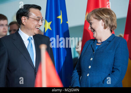 German Chancellor Angela Merkel and Chinese Prime Minister Li Keqiang witnessed the signing of 17 agreements between the two countries. Stock Photo