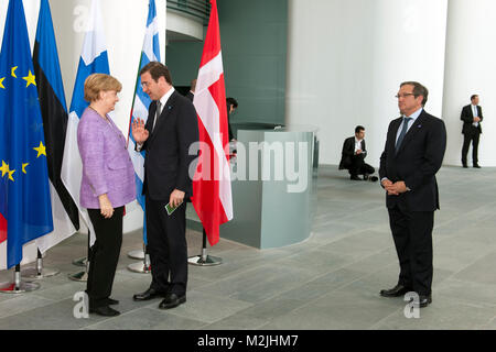 Portuguese Prime Minister Pedro Passos Coelho arrives to Berlin to a conference in the German Chancellery to combat the unemployment in Europe. Angela Merkel receives Pedro Passos Coelho. Stock Photo