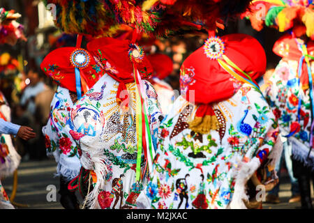 Horizontal photo of a Carnival scene, dancers wearing a traditional mexican folk with an amazing cape rich in color and bright Stock Photo