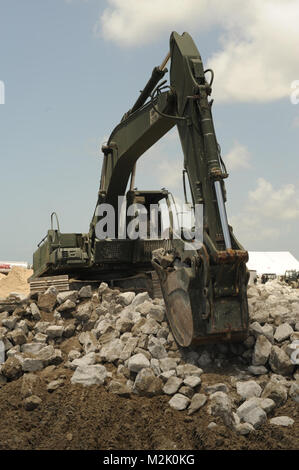 CAMINADA PASS, La. - Soldiers with the Louisiana Army National Guard, 527th Engineer Battalion, 225th Engineer Brigade, began work along Caminada Pass near Grand Isle, La., on July 13, 2010. Additional rock reinforcement, along 2,000 linear feet, will be added and the height of the wall will be raised. The rock wall creates a barrier between the Gulf of Mexico and the Louisiana wetlands to stop oil from traveling inland, in support of the Deepwater Horizon oil spill cleanup efforts. (U.S. Air Force photo by Staff Sgt. Jeffrey T. Barone, Louisiana National Guard Public Affairs Office/Released)  Stock Photo