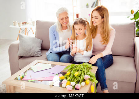 Rest comfort relax leisure creativity event spend time together concept. Cheerful sweet cute playful excited tender gentle schoolgirl cutting out 8 fo Stock Photo