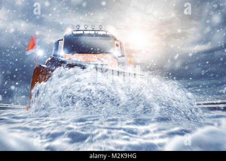 Professional snowplough on a snowy road Stock Photo