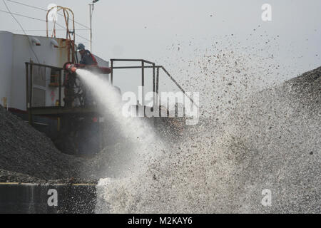 Contractors working for the U.S. Army Corps of Engineers, Norfolk District, use high-pressure water cannons to spread fossilized oyster shell in the Lynnhaven River in Virginia Beach, Va., in an effort to build medium relief oyster reefs for an ongoing oyster restoration project. Lynnhaven River Oyster Restoration (071130-A-5177B-009) by norfolkdistrict Stock Photo