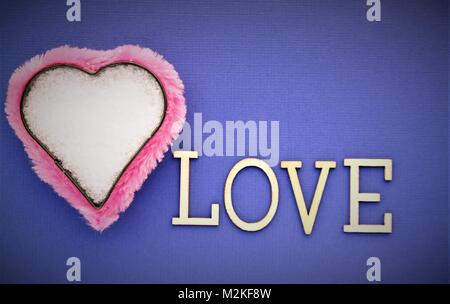 valentines day, pink heart and purple background, love symbol and text space