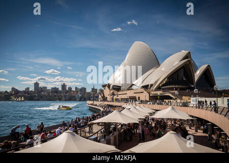 sydney opera house and harbour promenade outdoor cafes in australia on sunny day Stock Photo