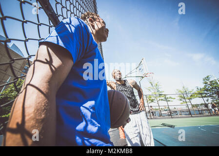 Two basketball players hanging around and having fun Stock Photo