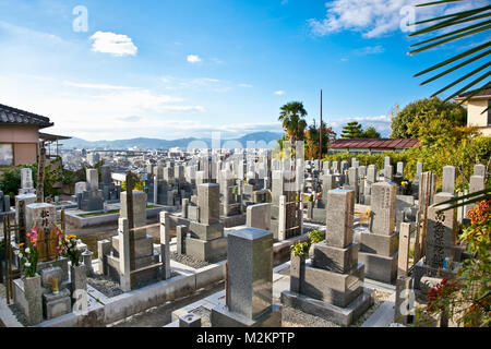 KYOTO, JAPAN - OCT 23, 2014: Buddhist cemetery on Oct 23, 2014 in Kyoto, Japan. The Japanese bury their dead by Buddhist traditions. Stock Photo
