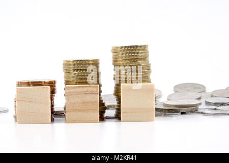 BUSINESS CONCEPT: Coins and wooden plate Stock Photo