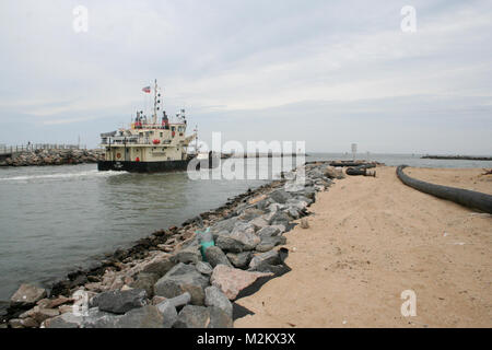 The U.S. Army Corps of Engineers’ dredge Fry is employed to remove a dangerous shoal at the entrance to Rudee Inlet in Virginia Beach, Va. on April 1, 2009. dredge Fry (090402-A-5177B-006) by norfolkdistrict Stock Photo