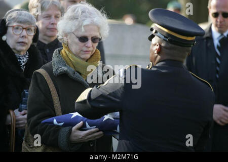 NEW YORK -- An Army soldier presents an American Flag to Debra Allee, the niece of the formerly oldest living female Marine, Miriam Cohen, who was buried Nov. 17, in Cypress Hills National Cemetery in honor of Cohen's service to her country. The 101-year-old Cohen enlisted in the Marine Corps in 1946 during World War II and again in 1960 during the Korean War. She was the oldest female enlistee of her time at 35 years old and was part of the first female Marine recruit class. (Official Marine Corps photo by Sgt. Randall A. Clinton) 091117-M-4003C-032 by NYCMarines Stock Photo