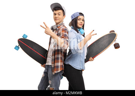 Teenage hipsters with longboards making peace signs isolated on white background Stock Photo