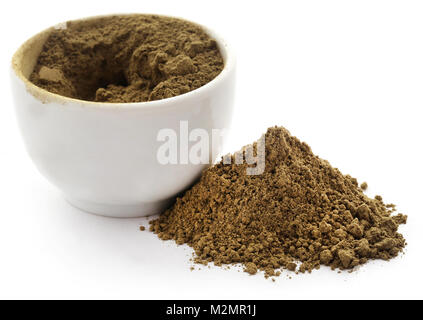 Henna hair dye powder in bowl over white background Stock Photo