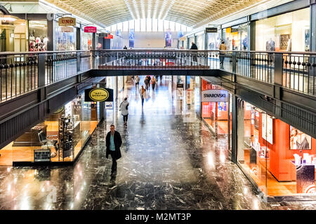 Washington DC, USA - October 27, 2017: Inside Union Station in capital city with shopping mall and arched ceiling by stores such as Shaving, Swarovski Stock Photo