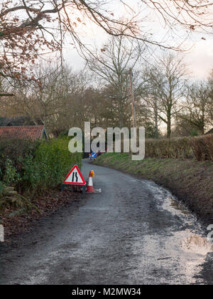 red triangle road sign lanes two lines traffic construction repair; essex; england; uk Stock Photo