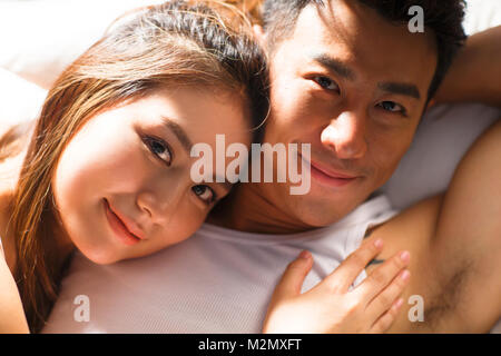 The young couple sleep in bed Stock Photo