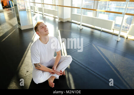 Guy doing drinking water before morning training.  Stock Photo