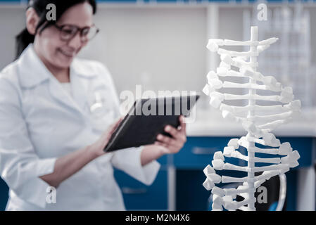 Cheerful researcher working on genetic project Stock Photo