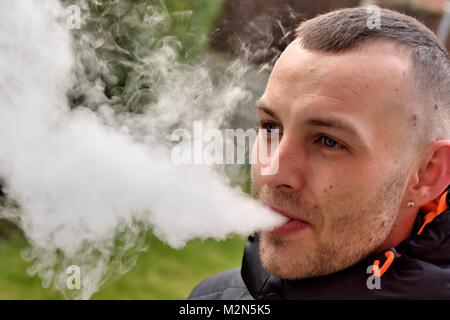A 27 year old man vaping UK Stock Photo