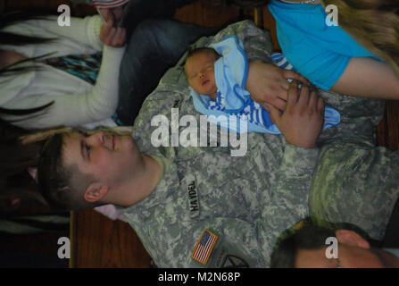 JEANERETTE, La. - Soldiers of the Louisiana Army National Guard's E Company, 199th Brigade Support Battalion, of the 256th Infantry Brigade Combat Team, bid farewell to family and friends at a deployment ceremony at Jeanerette High School in Jeanerette, La., Jan. 7.  (U.S. Army Photo by Sgt. Michael L. Owens, Louisiana National Guard State Unit Public Affairs Representative) 100107-A-0635O-009 by Louisiana National Guard Stock Photo