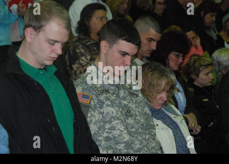 JEANERETTE, La. - Soldiers of the Louisiana Army National Guard's E Company, 199th Brigade Support Battalion, of the 256th Infantry Brigade Combat Team, bid farewell to family and friends at a deployment ceremony at Jeanerette High School in Jeanerette, La., Jan. 7.  (U.S. Army Photo by Sgt. Michael L. Owens, Louisiana National Guard State Unit Public Affairs Representative) 100107-A-0635O-029 by Louisiana National Guard Stock Photo