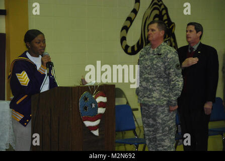 JEANERETTE, La. - Soldiers of the Louisiana Army National Guard's E Company, 199th Brigade Support Battalion, of the 256th Infantry Brigade Combat Team, bid farewell to family and friends at a deployment ceremony at Jeanerette High School in Jeanerette, La., Jan. 7.  (U.S. Army Photo by Sgt. Michael L. Owens, Louisiana National Guard State Unit Public Affairs Representative) 100107-A-0635O-035 by Louisiana National Guard Stock Photo