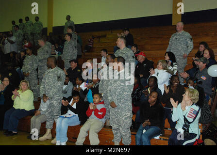 JEANERETTE, La. - Soldiers of the Louisiana Army National Guard's E Company, 199th Brigade Support Battalion, of the 256th Infantry Brigade Combat Team, bid farewell to family and friends at a deployment ceremony at Jeanerette High School in Jeanerette, La., Jan. 7.  (U.S. Army Photo by Sgt. Michael L. Owens, Louisiana National Guard State Unit Public Affairs Representative) 100107-A-0635O-046 by Louisiana National Guard Stock Photo