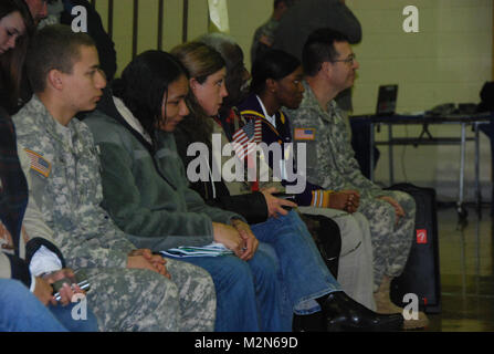 JEANERETTE, La. - Soldiers of the Louisiana Army National Guard's E Company, 199th Brigade Support Battalion, of the 256th Infantry Brigade Combat Team, bid farewell to family and friends at a deployment ceremony at Jeanerette High School in Jeanerette, La., Jan. 7.  (U.S. Army Photo by Sgt. Michael L. Owens, Louisiana National Guard State Unit Public Affairs Representative) 100107-A-0635O-054 by Louisiana National Guard Stock Photo