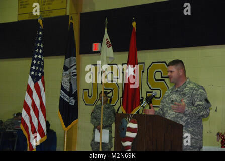 JEANERETTE, La. - Soldiers of the Louisiana Army National Guard's E Company, 199th Brigade Support Battalion, of the 256th Infantry Brigade Combat Team, bid farewell to family and friends at a deployment ceremony at Jeanerette High School in Jeanerette, La., Jan. 7.  (U.S. Army Photo by Sgt. Michael L. Owens, Louisiana National Guard State Unit Public Affairs Representative) 100107-A-0635O-084 by Louisiana National Guard Stock Photo