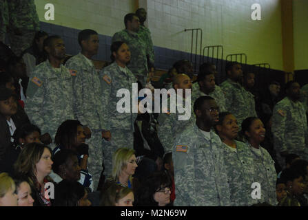 JEANERETTE, La. - Soldiers of the Louisiana Army National Guard's E Company, 199th Brigade Support Battalion, of the 256th Infantry Brigade Combat Team, bid farewell to family and friends at a deployment ceremony at Jeanerette High School in Jeanerette, La., Jan. 7.  (U.S. Army Photo by Sgt. Michael L. Owens, Louisiana National Guard State Unit Public Affairs Representative) 100107-A-0635O-101 by Louisiana National Guard Stock Photo