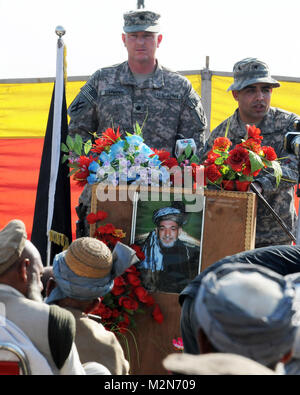 NANGARHAR PROVINCE, Afghanistan – U.S. Army Lt. Col. Russell V. Simmons, commander of the 1st Squadron, 108th Cavalry Regiment addresses village elders during a Shinwari tribal meeting in eastern Afghanistan’s Nangarhar province, Jan. 21.  More than 170 Maliks, or village elders, met for the traditional Afghan council hosted by the Afghan Border Police’s 6th Kandak. The jirga was an oportunity for the Maliks to voice security, education and corruption concerns. The Shinwari sub-tribes committed to working with security forces by signing an anti-Taliban Shinwari Pact.  The jirga, according to t Stock Photo