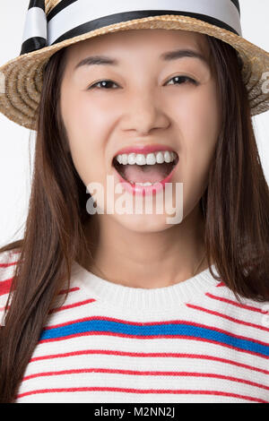 Portrait of a Beautiful Chinese American woman displaying a bit of attitude isolated on a white background Stock Photo