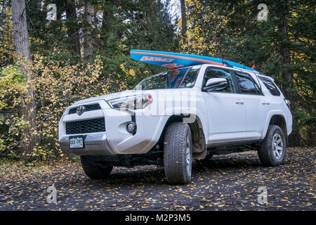 CRYSTAL, CO, USA - SEPTEMBER 28, 2016: Toyota 4Runner SUV (2016 Trail edition) carrying  a paddleboard on a back country road in Colorado's Rocky Moun Stock Photo