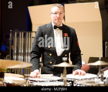 110313-N-5508A-005 GREENVALE, Ny  (March 13, 2011) Musician 1st Class Jason Niehoff prepares with his array of instruments for his percussion solo with the Navy Band. The Navy band is currently on a 22 day tour of the Northeast US. The U.S. Navy Band in Washington, D.C. is the Navy's premier musical organization and performs public concerts and military ceremonies in the greater Washington area and beyond. (U.S. Navy photo by Musician 1st Class David B. Aspinwall/Released) 110313-N-5508A-005 by United States Navy Band Stock Photo