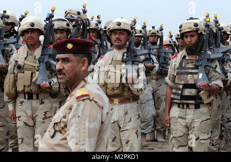 NUMANIYAH, Iraq – Soldiers of the 8th Iraqi Army Division charge their ...