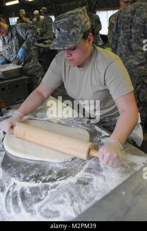 Spc. Isis Salgado of the 452nd Combat Support Hospital rolls dough for shortcake at the U.S. Army Reserve's Connelly Competition at Fort McCoy, Wis., on April 9.  (Photo by Maj. Matt Lawrence, 807th MDSC Public Affairs) 20110409-DSC 2645 by 807MCDS Stock Photo