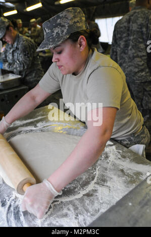 Spc. Isis Salgado of the 452nd Combat Support Hospital rolls dough for shortcake at the U.S. Army Reserve's Connelly Competition at Fort McCoy, Wis., on April 9.  (Photo by Maj. Matt Lawrence, 807th MDSC Public Affairs). 20110409-DSC 2656 by 807MCDS Stock Photo