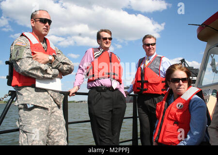 From left, Col. Andy Backus, Norfolk District, U.S. Army Corps of Engineers commander, Greg Steele, the district's flood plain management services section planning chief; Mike Darrow, the district's water resources division chief and Jo-Ellen Darcy, assistant secretary of the Army for civil works, view the Elizabeth river while aboard the Work Vessel Harrell. Darcy visited the district and viewed several of the ongoing projects. (U.S. Army photo/Kerry Solan) 110430-A-ET072-045 by norfolkdistrict Stock Photo