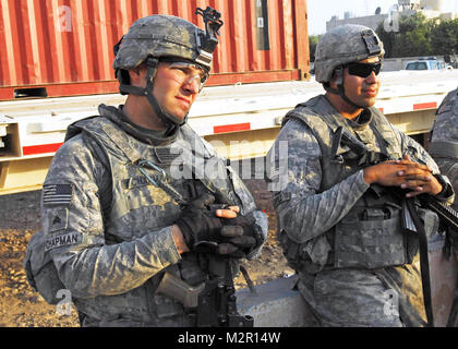 Review. CONTINGENCY OPERATING SITE WARRIOR, Iraq – Sergeant Kevin Chapman, left, an infantryman from Conyers, Ga., assigned to Company D, 2nd Battalion, 12th Cavalry Regiment, 1st Advise and Assist Task Force, 1st Infantry Division, and Spc. Jesus Lopez, attend an after action review immediately following a security patrol in Kirkuk, Iraq, July 16, 2011. Chapman, a squad leader and vehicle commander for “Bulldog” 2nd Platoon, leads troops on counter-indirect fire patrols, checkpoint security sites and snap traffic control points while deployed to U.S. Division – North in support of Operation N Stock Photo