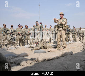 Sgt. Joseph Macklin, a combat engineer in the Australian army, currently attached to the Task Force Paladin J7, demonstrates IED detection and identification to soldiers in A company, 1st Battalion, 5th Infantry Regiment, 1st Stryker Brigade Combat Team, 25th Infantry Division, at Forward Operating Base Mushan on 5 October. U.S. Army photo by Sgt. Michael Blalack, 1/25 SBCT Public Affairs 111005-A-6251B-017 by 1 Stryker Brigade Combat Team Arctic Wolves Stock Photo