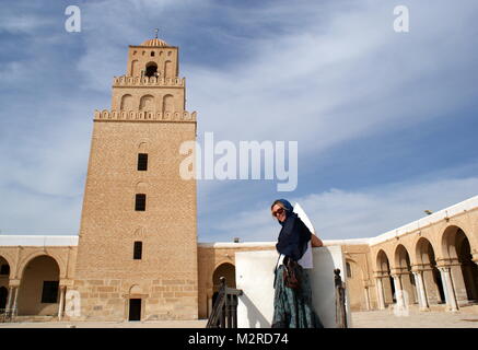 Lady in blue scarf at The Great Mosque of Kairouan, Kairouan, Tunisia Stock Photo