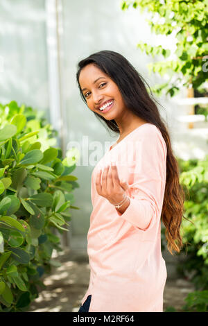 Young beautiful hispanic woman smiling. Stock Photo