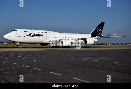 A Boeing 747-8 departs from the Tegel airport in Berlin, Germany, 8 February 2018. Lufthansa launches the redesign of their crane logo on the occasion of their 100th anniversary. Photo: Britta Pedersen/dpa Stock Photo